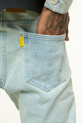 "MENDING HEARTS" EMBOSSED FLARE STACK DENIM (LIGHT BLUE/SAND)