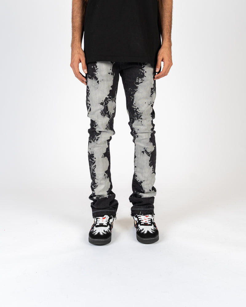 "SCARRED BY" FLARE STACK DENIM